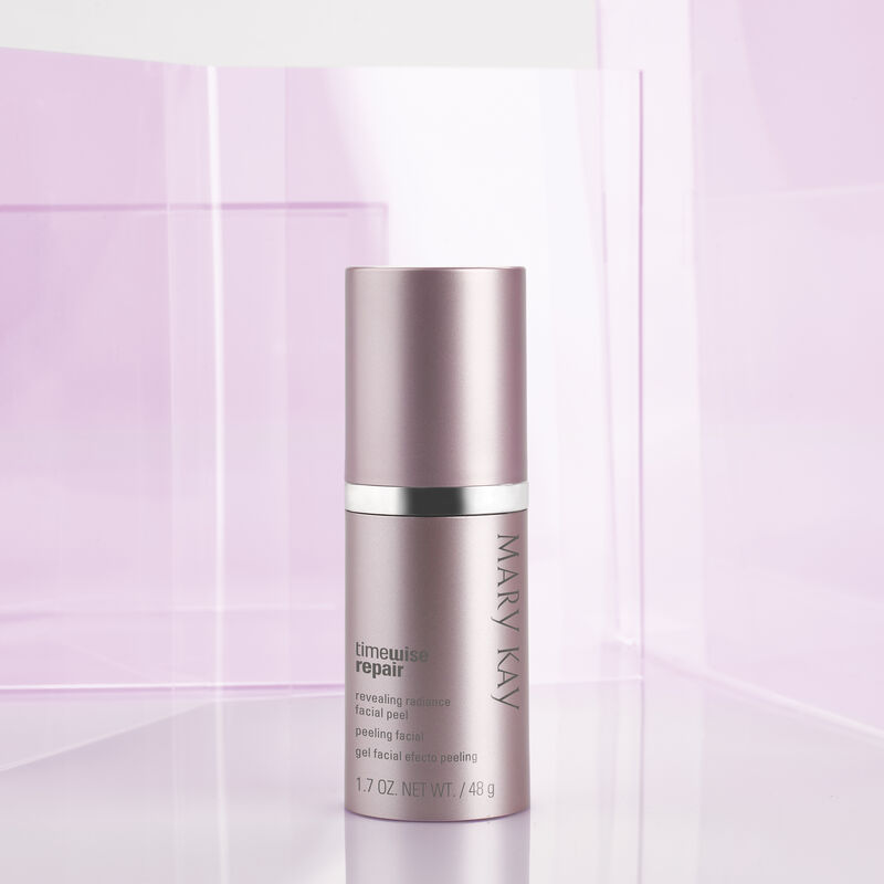 Bottle of TimeWise Repair Revealing Radiance Facial Peel from Mary Kay with cap on standing in purple hued setting.