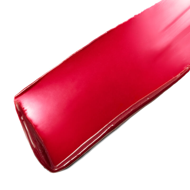 Swipe of limited-edition Mary Kay Tinted Lip Balm in Radiant Pink against white background