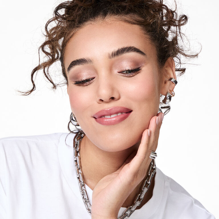 Woman showing off glittery eyeshadow look