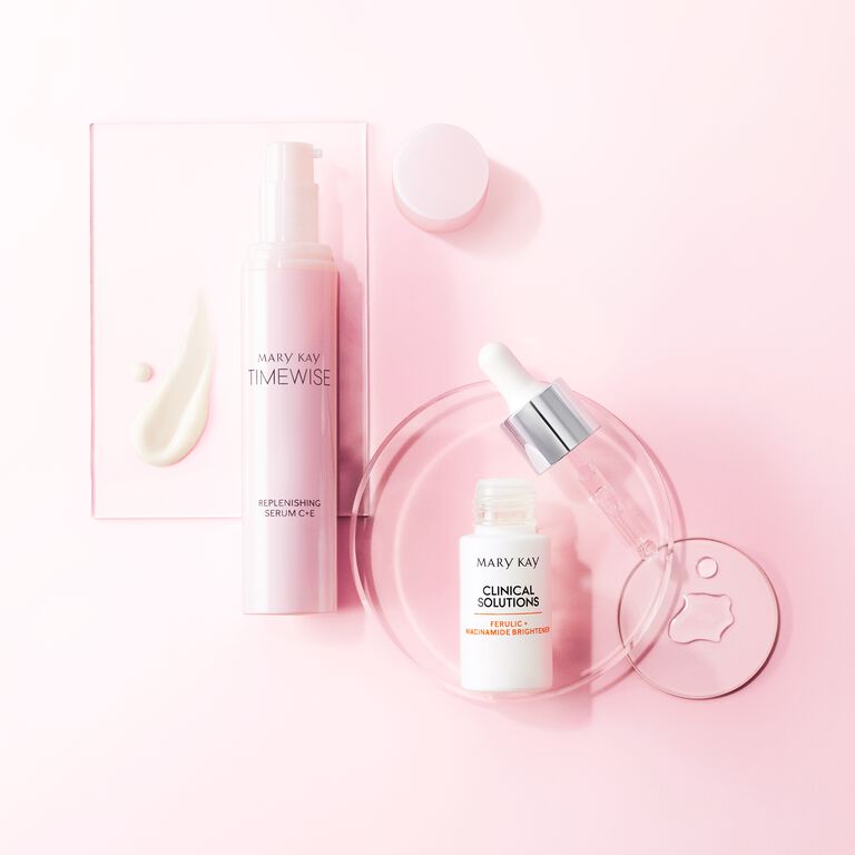 Mary Kay Clinical Solutions Brightener and Vitamin C+E Serum on scientific glass dishes